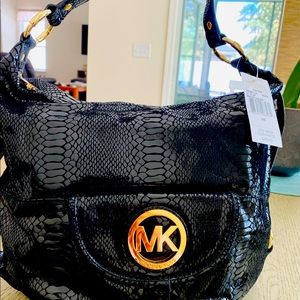 MICHAEL KORS black leather style hobo bag.
